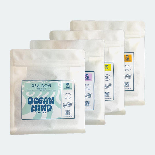Sea Dog coffee beans with 'Ocean Mind Coffee' branding on a sea mist background